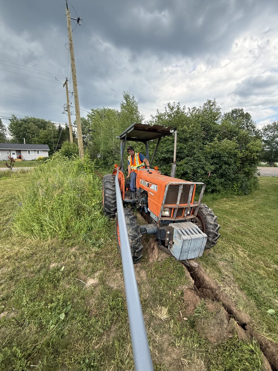 Tinuum underground fibre construction, plowing conduit along a rural property line